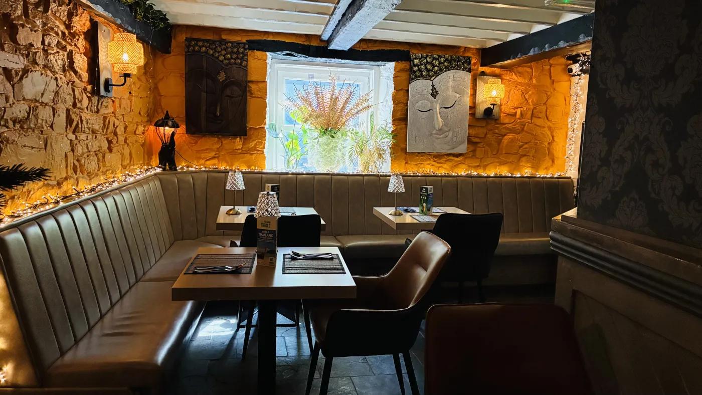Warm booth seating at Jasmine Thai